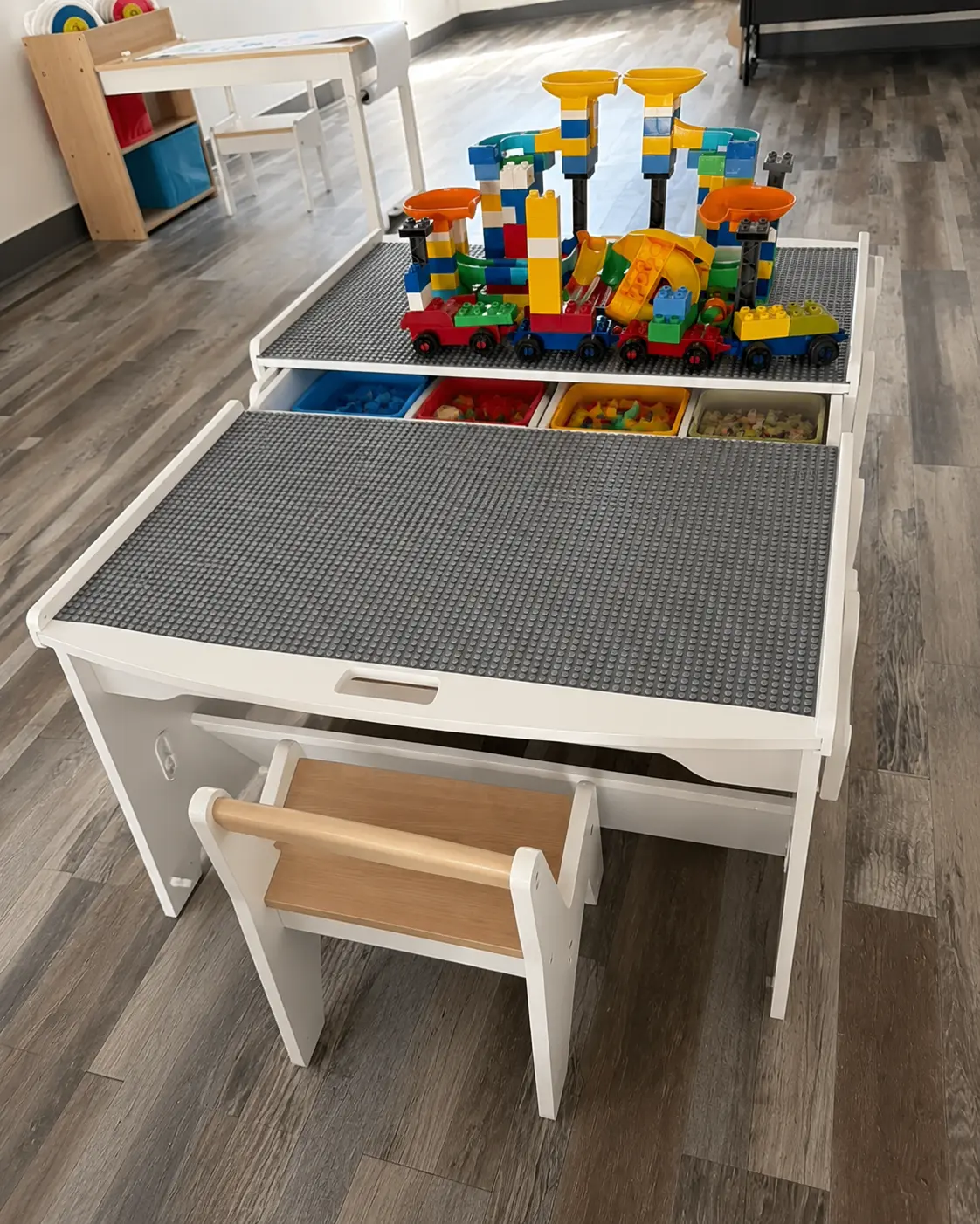 LEGOS at Fun Together — A giant build table stocked with DUPLO and classic bricks. Stack, sort, imagine, repeat.